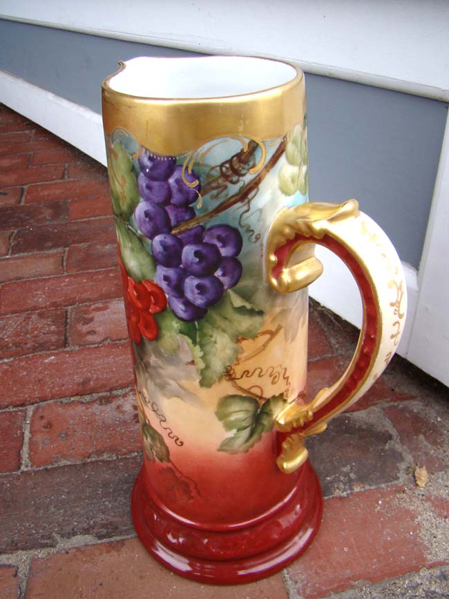A fine hand painted French porcelain (Limoges?) wine jug circa 1890